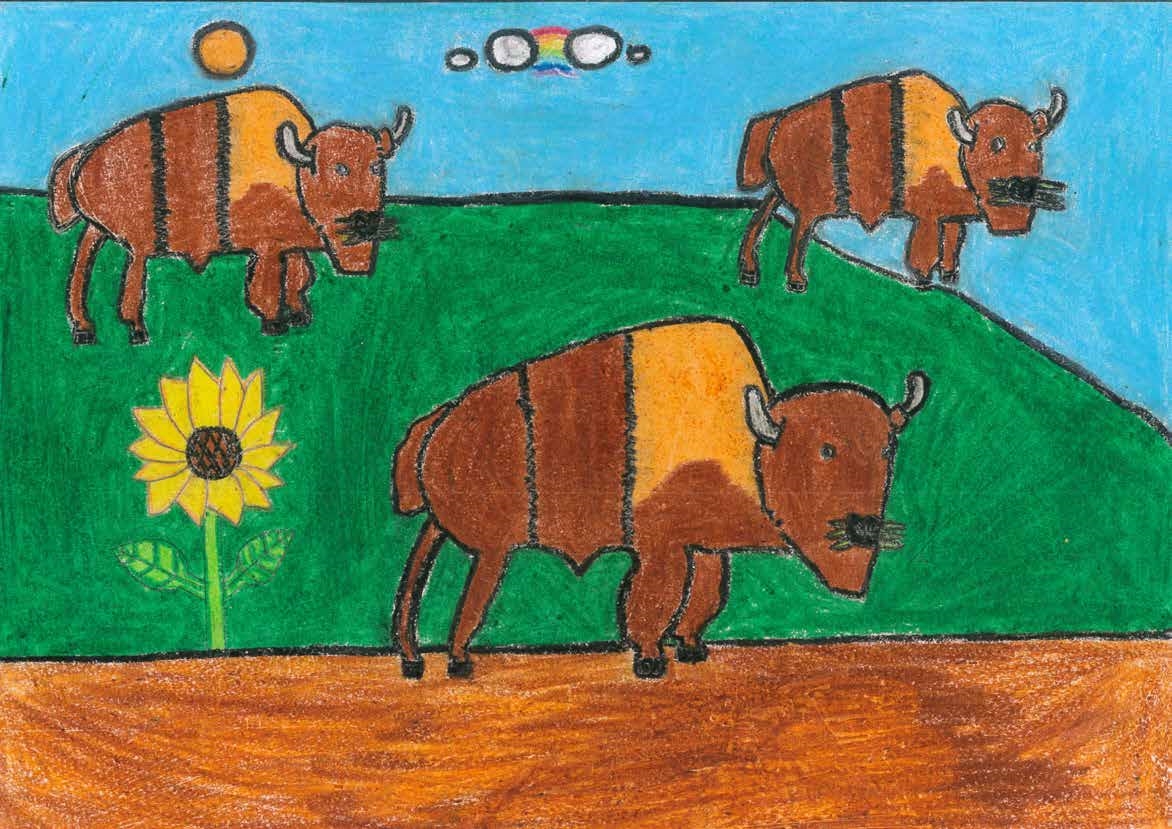 不同品種的牛也在草地上吃草，他們的顏色比較深，是咖啡色，有三隻。